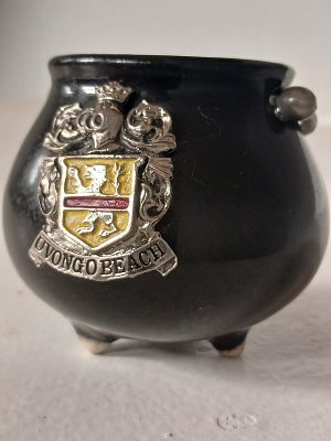 Vintage Three-Legged Uvongo Beach Ceramic Pot – Black Enamel with Metal Handle. A charming 