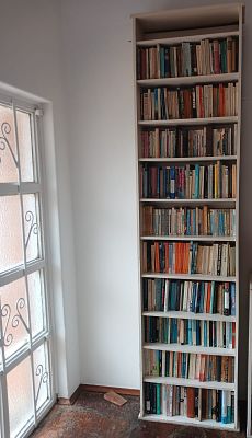Tall Bookshelf with Books. Add character and practicality to any room with this tall bookshelf 