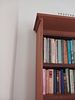 Tall Wood Finished Bookshelf with Books. Add character and practicality to any room with this Image - 1