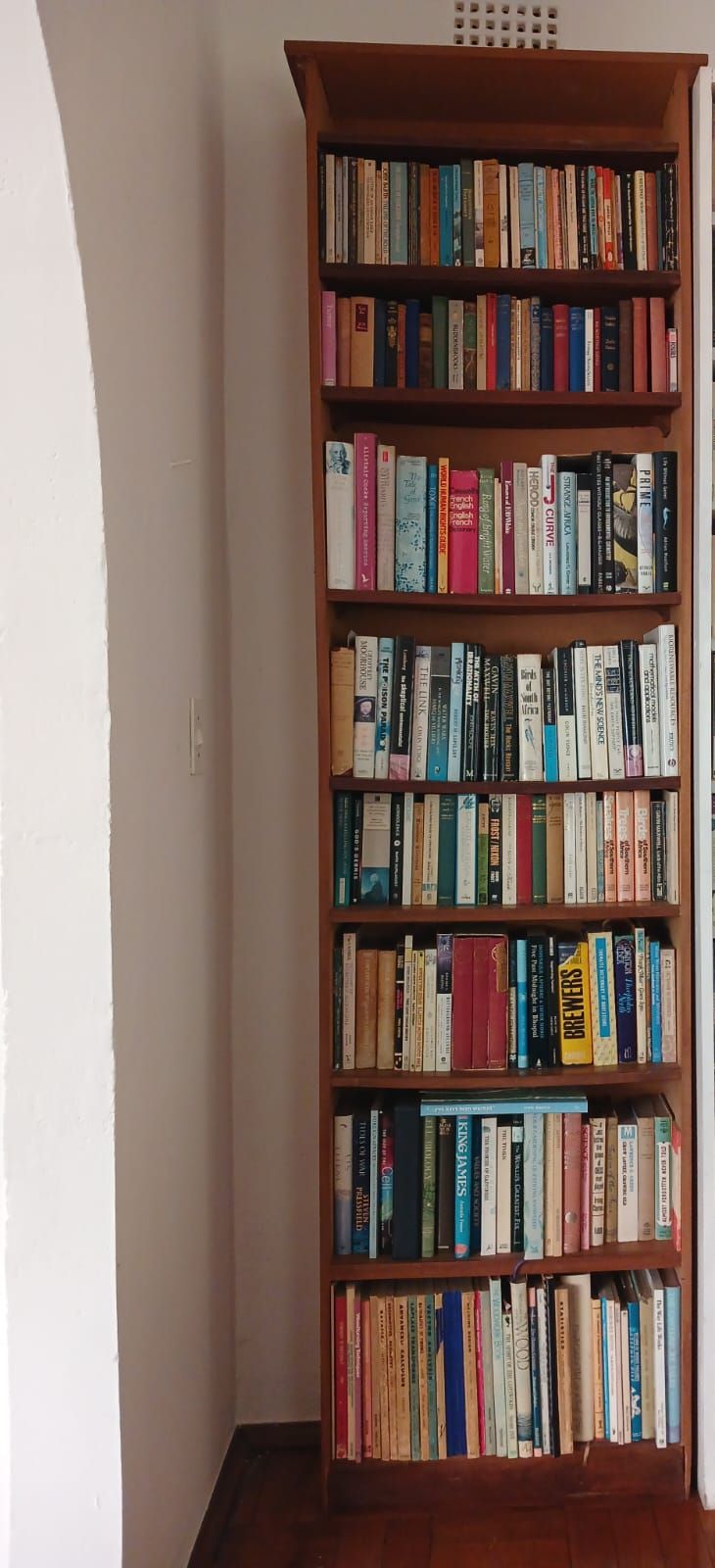 Tall Wood Finished Bookshelf with Books. Add character and practicality to any room with this 