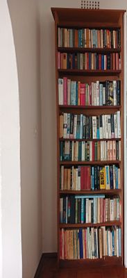 Tall Wood Finished Bookshelf with Books. Add character and practicality to any room with this 