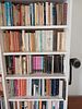 Tall White Bookshelf with Books. Add character and practicality to any room with this tall Image - 2
