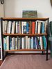 Mid-Century Bookshelf with Books & Painting . Add character and practicality to any room with Image - 1