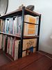 Mid-Century Bookshelf with Books. Add character and practicality to any room with this Image - 1