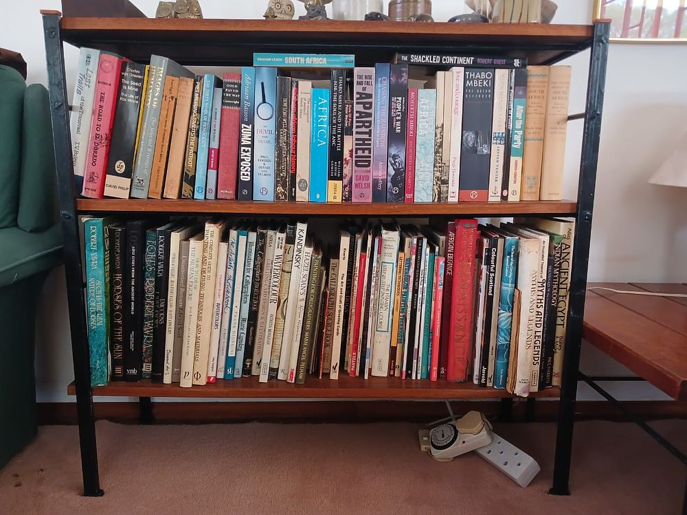 Mid-Century Bookshelf with Books. Add character and practicality to any room with this 