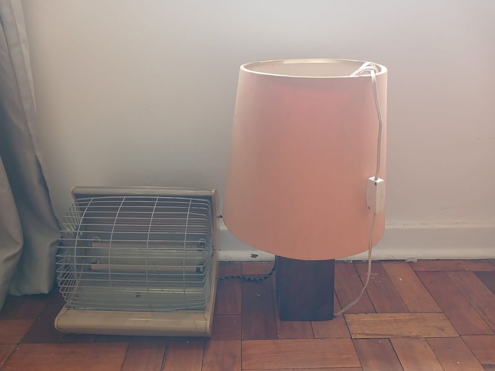 Vintage Heater & Sleeper Wood Table Lamp. This lot features a vintage heater alongside a unique 