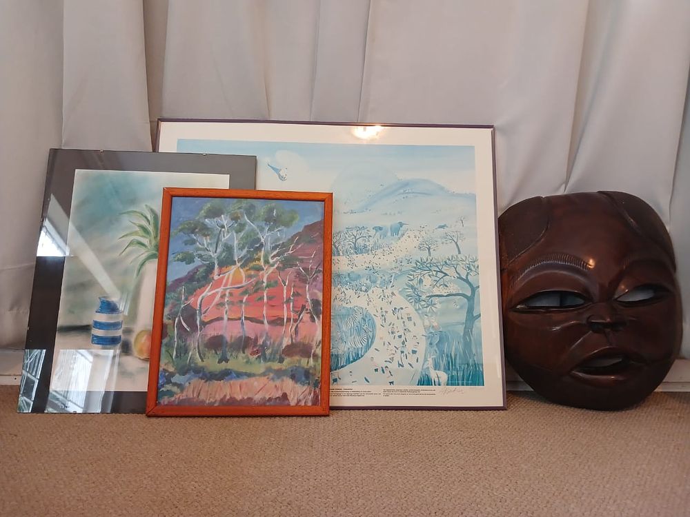 Selection of Wall Art. Eclectic selection of wall art featuring paintings, prints, and a 