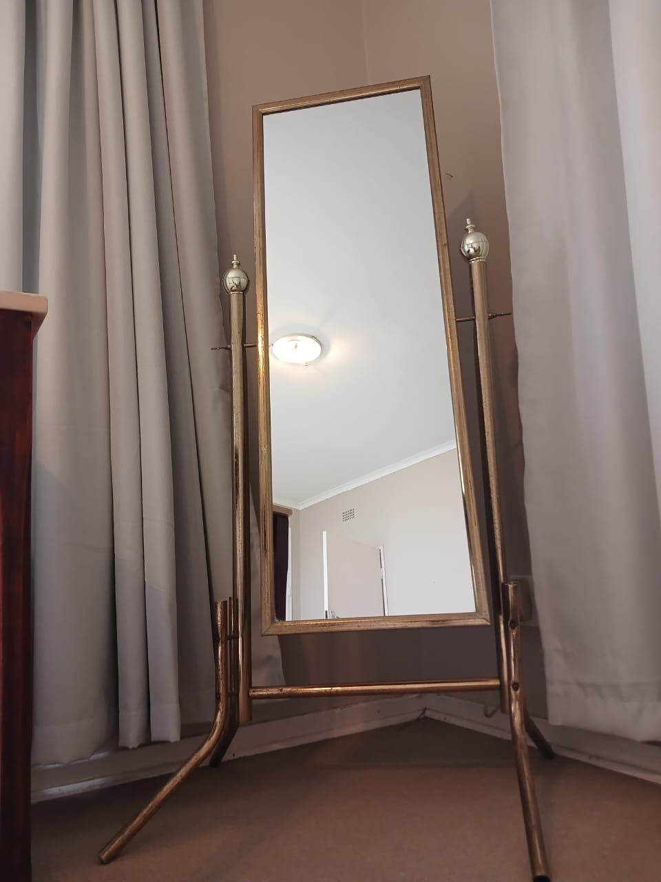 Brass Stand Cheval Mirror. Elegant brass cheval mirror with freestanding design, perfect for 