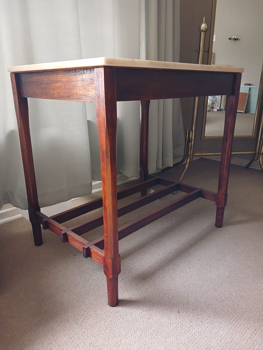 Stunning Marble Top Table. Stunning wooden table featuring a polished marble top, combining 