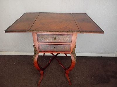 Vintage Victorian Drop Leaf Side Table. This side table features ornate brass embellishments. 