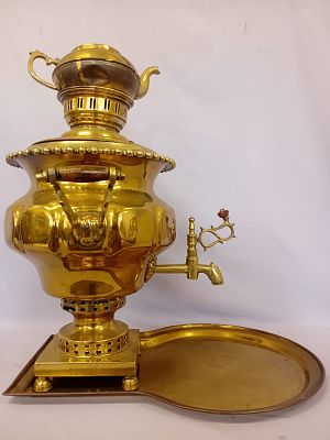 Vintage Samovar . A vintage brass samovar is a traditional Russian-style tea urn, often ornately 