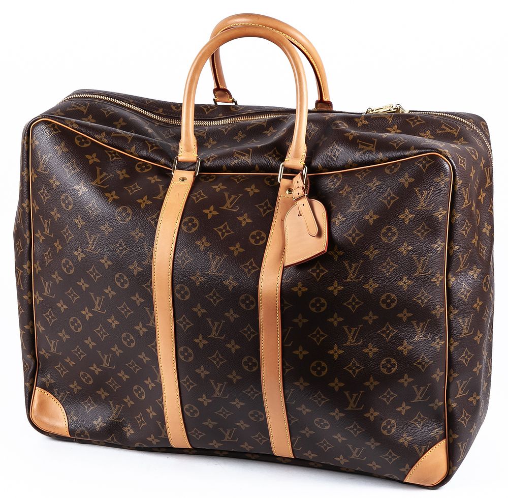 LOUIS VUITTON. A travel bag crafted in iconic Monogram canvas and leather 400 - 600 €