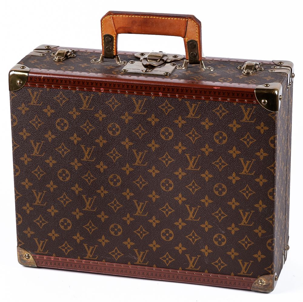 LOUIS VUITTON. A toiletry case briefcase in Monogram canvas, leather, with golden brass locks 