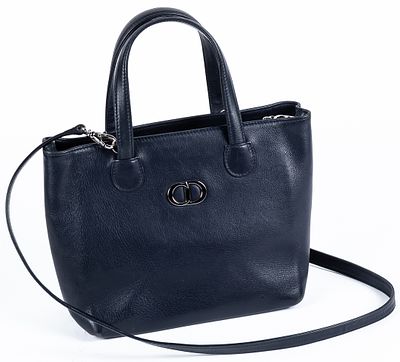 DIOR. A navy leather tote bag with silver-tone metal monogram 350 - 450 €