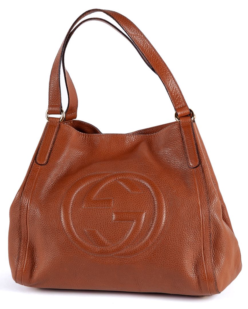 GUCCI. A "Soho" camel leather bag with embossed monogram 300 - 400 €