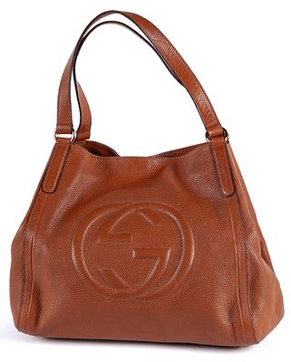 GUCCI. A "Soho" camel leather bag with embossed monogram 300 - 400 €