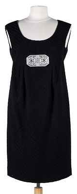 VALENTINO. A black wool dress with Art Deco brooch. Size 42 700 - 900 €