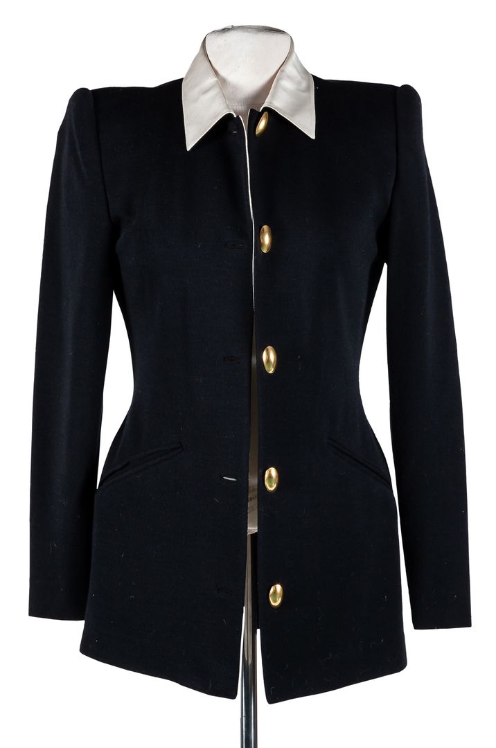 DONNA KARAN. A black jacket with white collar and yellow buttons 125 - 200 €