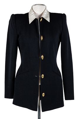 DONNA KARAN. A black jacket with white collar and yellow buttons 125 - 200 €