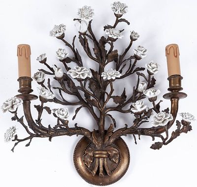 A metal two-light wall-sconce filled with white porcelain flowers, c.1900 40 x 41 cm 80 - 250 €