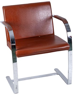 A chromed-steel brown-leather upholstered armchair 78 x 59 x 59 cm 150 - 200 €