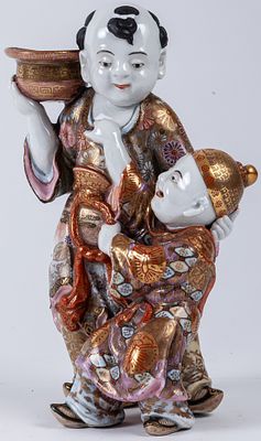 A Satsuma porcelain candlestick 'Father and son' 26 cm 100 - 250 €