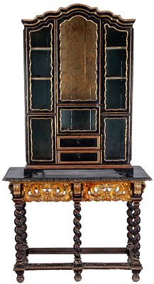 An 18th-century carved, parcel-gilt and polychrome-painted wood display cabinet. On a 