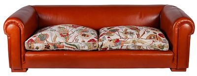 A Chesterfield style leather sofa with patterned fabric cushions 66 x 87 x 210 cm €100 – 300