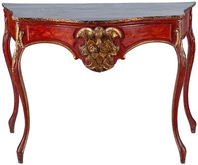 A Spanish parcel-gilt red-painted console table, 19th Century 86 x 57 x 119 cm 125 - 200 €