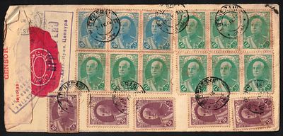 An unusually stamped airmail envelope with dozens of Iranian stamps from the era of the Persian 