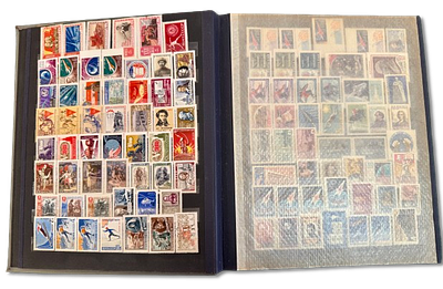 Soviet Union stamp album with hundreds of stamps from the 1950s-1960s. Most stamps are unsigned 