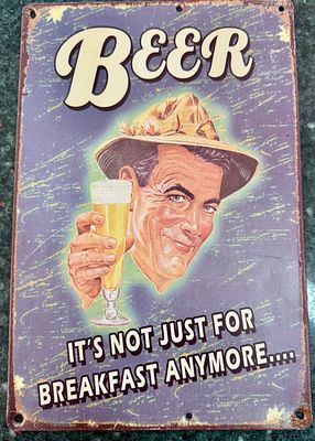 A tin replica of a vintage-style metal sign with the inscription "BEER - IT'S NOT JUST FOR 