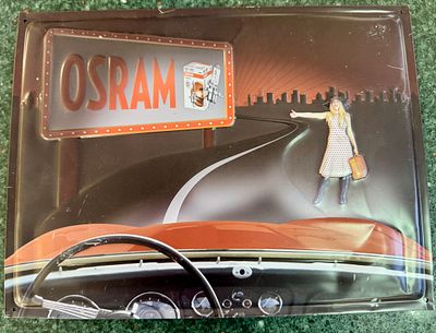 An embossed tin sign in a retro design of the OSRAM light bulb brand - on the front a 