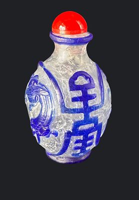 Chinese overlay glass snuff bottle, carved clear crystal with raised cobalt blue dragon and 