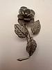 Silver filigree brooch in the form of a flower, featuring finely detailed leaves and stem. Изображение - 1