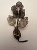 Silver filigree brooch in the form of a flower, featuring finely detailed leaves and stem. Изображение - 4