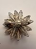 Silver filigree round brooch designed as a flower, featuring delicate coiled wire petals. Изображение - 1