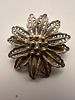 Silver filigree round brooch designed as a flower, featuring delicate coiled wire petals. Изображение - 2