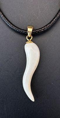 Elegant S-shaped pendant crafted from a fine organic material, featuring a smooth polished 
