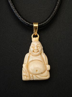 Hand-carved seated Buddha pendant crafted from a fine organic material, depicting a joyful 