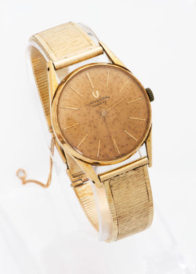 שעון וינטג' Universal Golden Shadow מזהב 18 קראט. מנגנון: אוטומטי 
פני השעון: זהב 
רצועה: זהב 