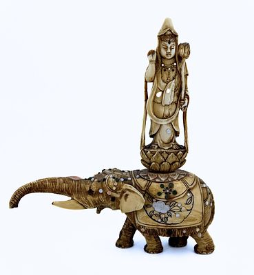 Okimono figurine made of organic material, in the form of a woman on an elephant, late 19th 