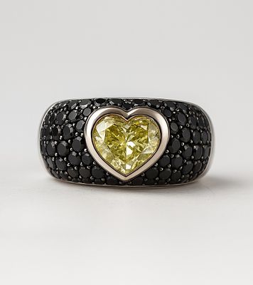 Heart-Shaped Diamond Ring 18K White Gold. Set with a 1-carat yellow diamond and black diamonds