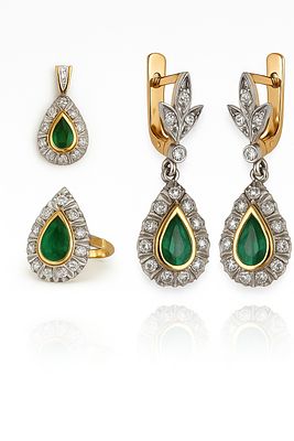 18K Gold Set: Pair of Earrings, Pendant, and Ring. An impressive teardrop-shaped set, set with