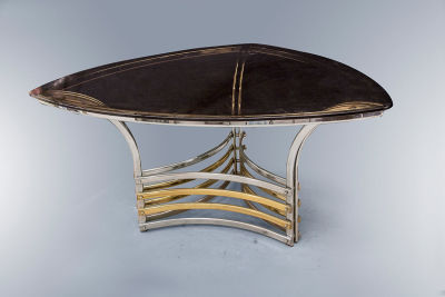 A Chrome and Glass Triangular Dining Table, 1970's. Dimensions Height: 75 cm, width: 150.5 