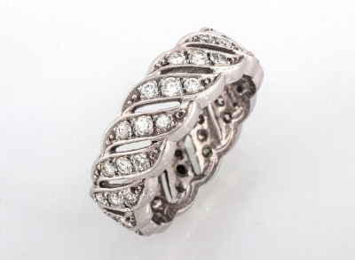An Antique Diamond and Platinum Wedding Band, Circa 1900. Details Open work with set with 