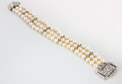 A Fine Pearl and Diamond Art Deco Bracelet. Dimensions Length: 18 cm Provenance Estate of 