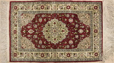 A Fine Small Persian Silk and Gold Thread Rug. <span 
