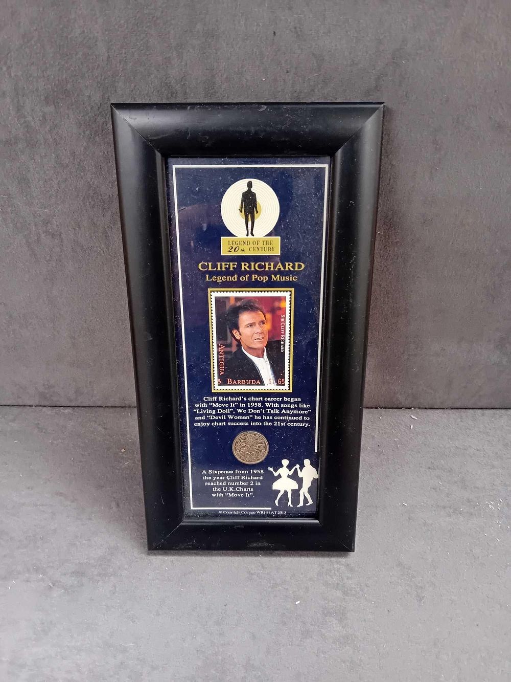 Lot 418: Cliff Richard framed stamp and sixpence from 1985...