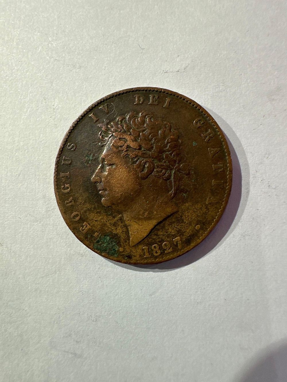 Lot 668: Rare 1827 king George half penny used condition